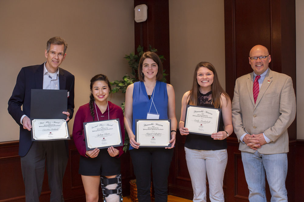 Dr. Wietse de Boer, Ms. Godard’s faculty advisor, who accepted on her behalf as she currently studying abroad in Paris, France; Sydney Chuen; Abigail Culpepper; Emily Mendenhall; and Miami University President Dr. Greg Crawford pose for a photo at the Undergraduate Research Forum Luncheon on Wednesday, April 25, 2018.